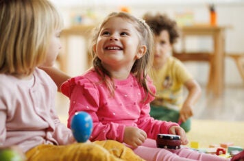 Children playing in a nursery room