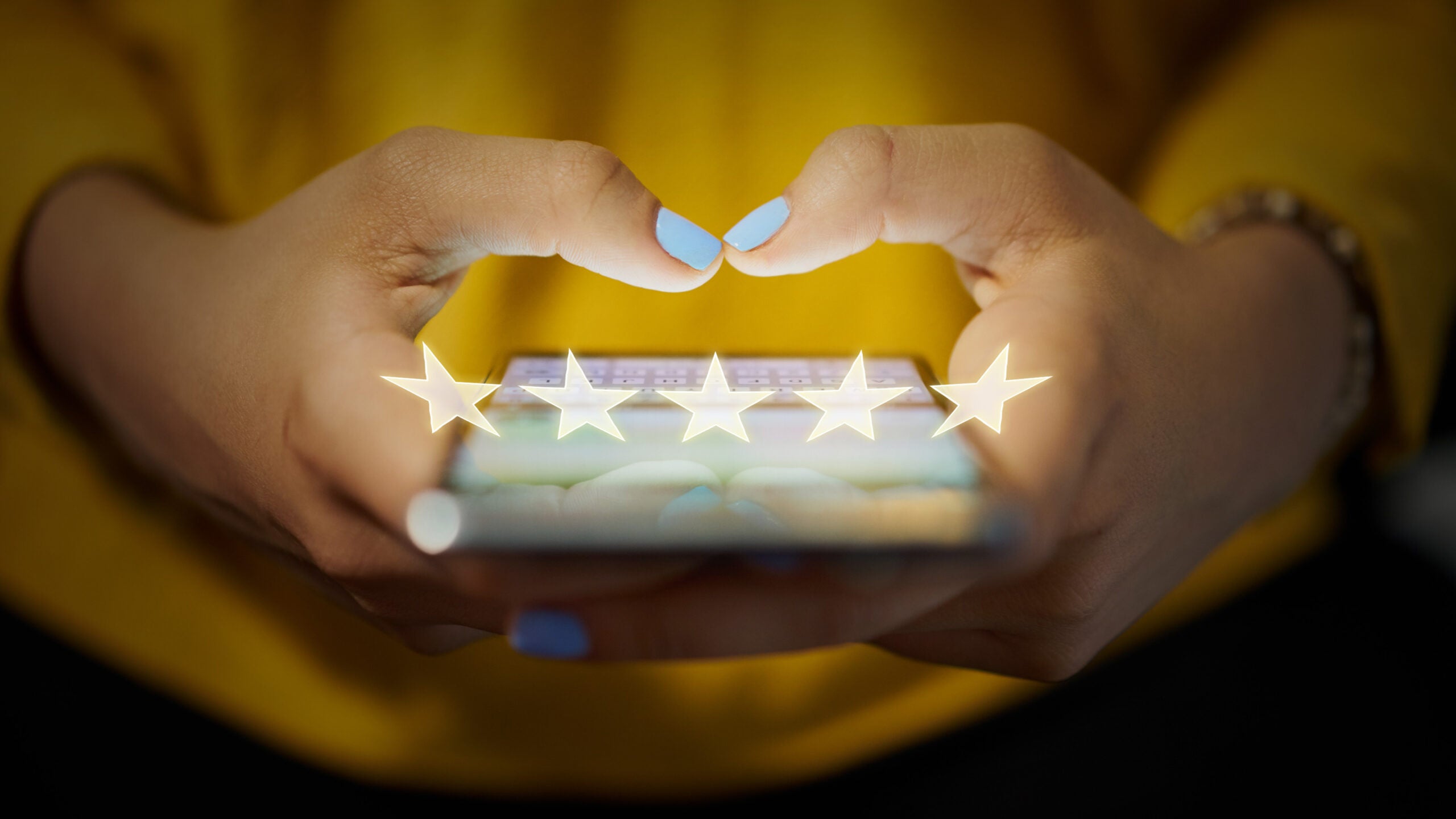 Person adding review on their phone