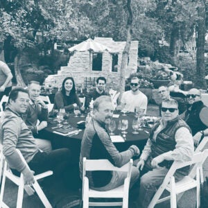 Nine employees having lunch outside