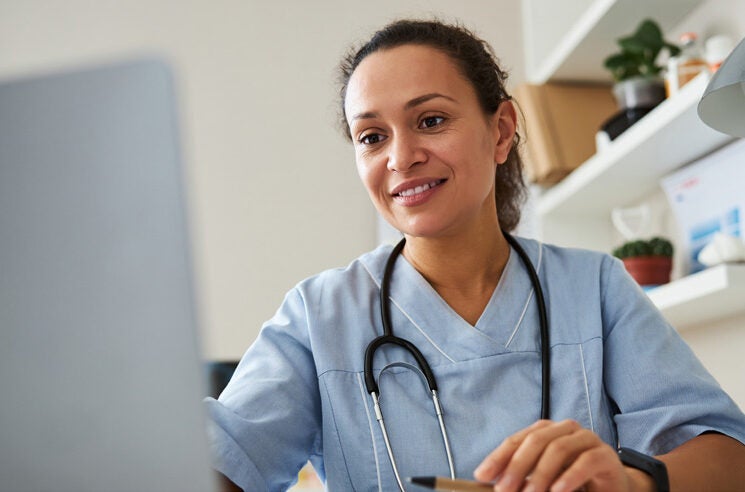 woman doctor working at computer