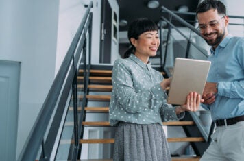 Co-workers meeting on stairs